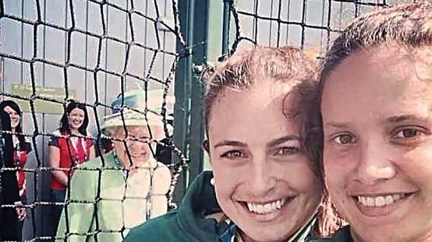 Jayde Taylor and teammate Brooke Perris get photobombed by the Queen at the Commonwealth Games